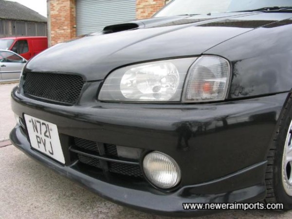 Meshed front grille and bumper