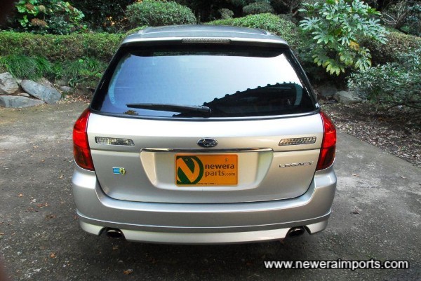 High level rear spoiler has LED brake lamp integrated in the middle.